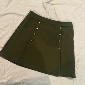 Green pleated mini skirt